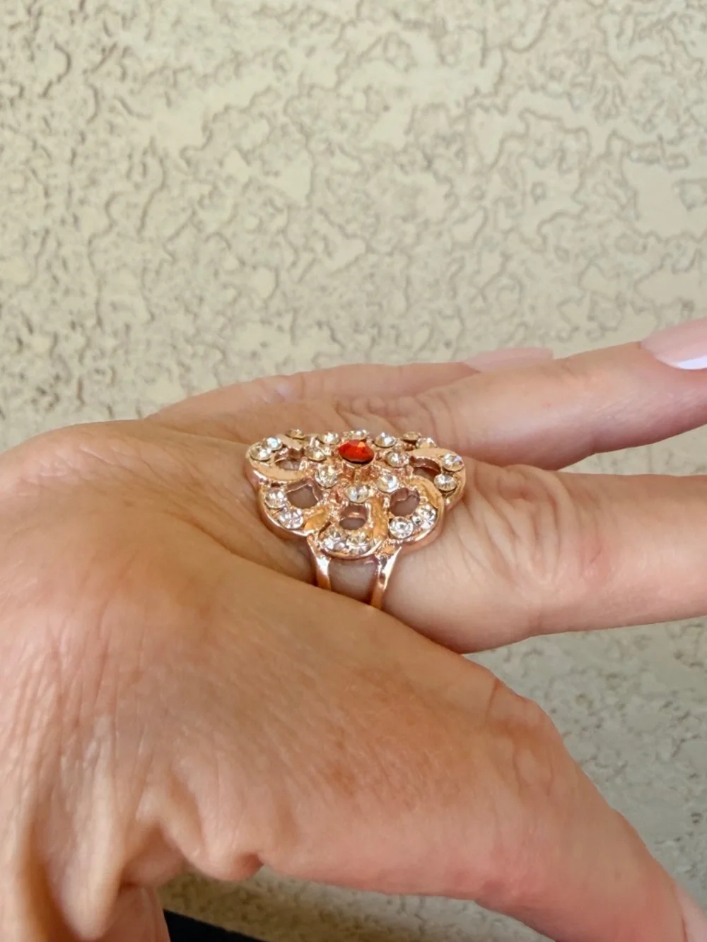 Intricate Rose Gold Floral Statement Ring with Orange Center Stone